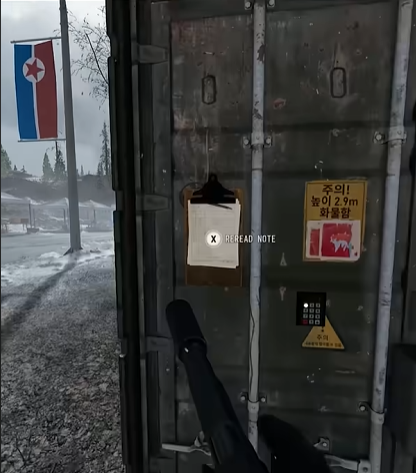South East Village shipping container in front of the red sign (652, 187)